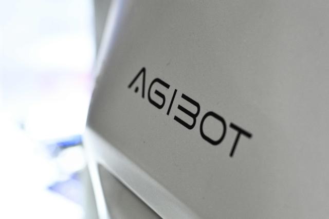 The Agibot logo is pictured on a humanoid robot during the World Artificial Intelligence Conference (WAIC) in Shanghai on July 18, 2026. (Photo by Hector RETAMAL / AFP)