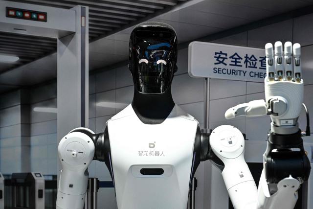 A humanoid robot by Agibot is pictured during the World Artificial Intelligence Conference (WAIC) in Shanghai on July 18, 2026. (Photo by Hector RETAMAL / AFP)