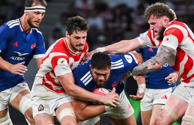France’s Emmanuel Meafou is tackled  by the Japanese defence during the Rugby Nations Championship Southern Hemisphere Series against France at the National Stadium in Tokyo on July 18, 2026. (Photo by ANDREW CABALLERO-REYNOLDS / AFP)