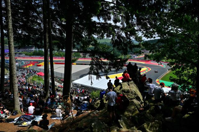 Members of the public watch Haas F1 Team's British driver Oliver Bearman during the third practice session at the Spa-Francorchamps circuit, in Spa, ahead of the Formula One Belgian Grand Prix, on July 18, 2026. (Photo by Andrej ISAKOVIC / AFP)