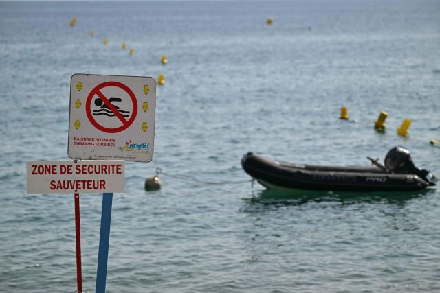 A sign reads swimming forbidden” at Le Racou beach in Argeles-sur-Mer, on the Mediterranean coast in southwestern France, on July 18, 2026. (Photo by Lionel BONAVENTURE / AFP)