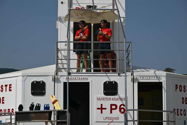 Lifeguards monitor the beach from their observation tower at Le Racou beach in Argeles-sur-Mer, on the Mediterranean coast in southwestern France, on July 18, 2026. (Photo by Lionel BONAVENTURE / AFP)