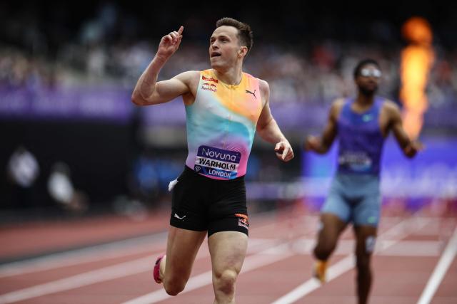 Norway's Karsten Warholm celebrates after crossing the finish line to win the men's 400m hurdles event during the IAAF Diamond League athletics competition at the London stadium in London on July 18, 2026. (Photo by Henry NICHOLLS / AFP)