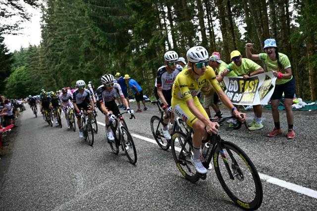 UAE Team Emirates - XRG's Slovenian rider Tadej Pogacar wearing the overall leader's yellow jersey cycles in the ascent of the Grand Ballon during the 14th stage of the 113th edition of the Tour de France cycling race, 155,3 km between Mulhouse and Le Markstein in the Vosges mountains, on July 18, 2026. (Photo by Loic VENANCE / AFP)