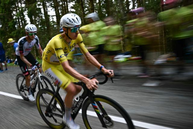 UAE Team Emirates - XRG's Slovenian rider Tadej Pogacar wearing the overall leader's yellow jersey cycles in the ascent of the Grand Ballon during the 14th stage of the 113th edition of the Tour de France cycling race, 155,3 km between Mulhouse and Le Markstein in the Vosges mountains, on July 18, 2026. (Photo by Loic VENANCE / AFP)