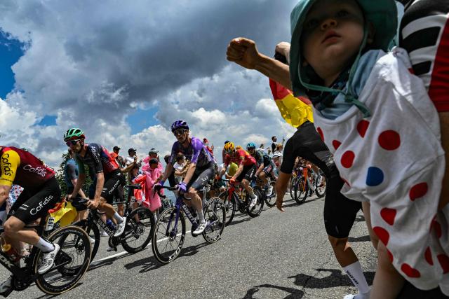 Decathlon CMA CGM Team's Belgian rider Tiesj Benoot and Team Jayco AlUla's Swiss rider Mauro Schmid cycle during the 14th stage of the 113th edition of the Tour de France cycling race, 155,3 km between Mulhouse and Le Markstein in the Vosges mountains, on July 18, 2026. (Photo by Jeff PACHOUD / AFP)