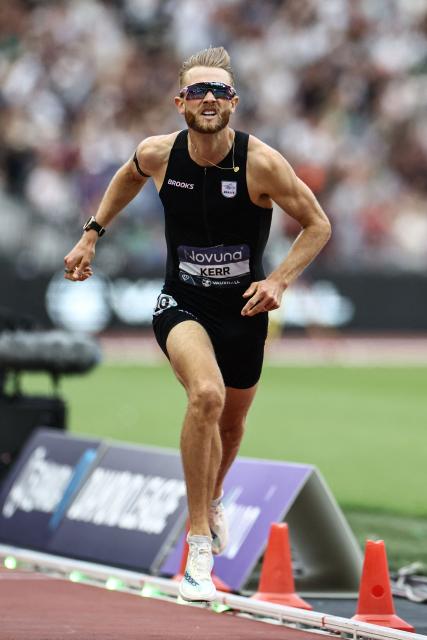 Britain's Josh Kerr crosses the finish line to win the men's one mile event during the IAAF Diamond League athletics competition at the London stadium in London on July 18, 2026. (Photo by Henry NICHOLLS / AFP)