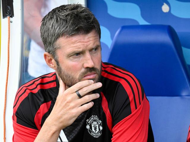 Manchester United's English head coach Michael Carrick sits on the bench during the  pre-season friendly match between English Premier League football club Manchester United and EFL Championship club Wrexham AFC at Helsinki Olympic Stadium in Helsinki, Finland on July 18, 2026. (Photo by Markku Ulander / Lehtikuva / AFP) / Finland OUT