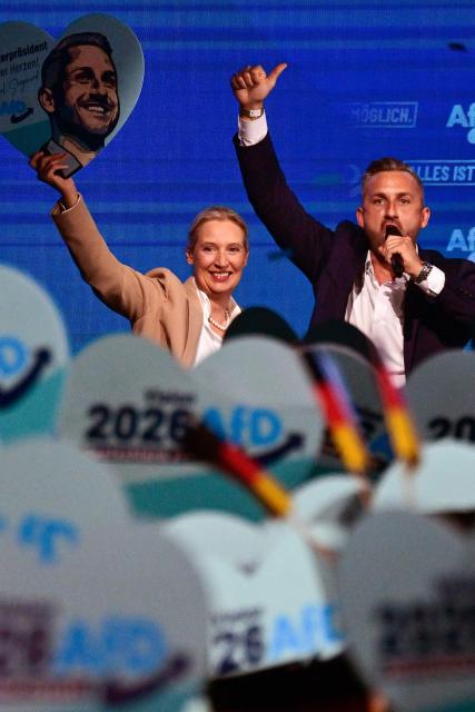 Alice Weidel (L), co-leader of the far-right Alternative for Germany (AfD) party, and  Ulrich Siegmund, AfD top candidate for Saxony-Anhalt are cheered by supportes during an election campaign event ahead of the state elections in Saxony-Anhalt, in Magdeburg, eastern Germany on July 18, 2026. Slogan reads "Everything is possible". The crucial state election in the German eastern federal state of Saxony-Anhalt is scheduled to take place on September 6, 2026. (Photo by John MACDOUGALL / AFP)