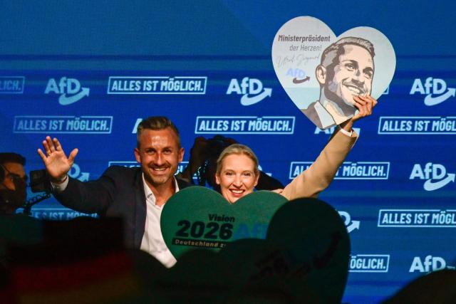 Alice Weidel (R), co-leader of the far-right Alternative for Germany (AfD) party, and  Ulrich Siegmund, AfD top candidate for Saxony-Anhalt are cheered by supportes during an election campaign event ahead of the state elections in Saxony-Anhalt, in Magdeburg, eastern Germany on July 18, 2026. Slogan reads "Everything is possible". The crucial state election in the German eastern federal state of Saxony-Anhalt is scheduled to take place on September 6, 2026. (Photo by John MACDOUGALL / AFP)