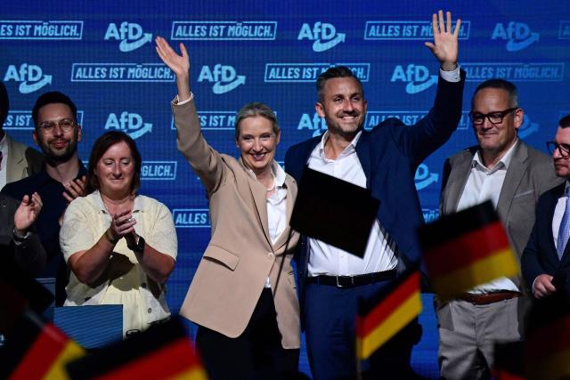 Alice Weidel (C, L), co-leader of the far-right Alternative for Germany (AfD) party, and Ulrich Siegmund (C, R), AfD top candidate for Saxony-Anhalt wave to supportes on stage togehter with other members of the party leadership at the end of an election campaign event ahead of the state elections in Saxony-Anhalt, in Magdeburg, eastern Germany on July 18, 2026. Slogan reads "Everything is possible". The crucial state election in the German eastern federal state of Saxony-Anhalt is scheduled to take place on September 6, 2026. (Photo by John MACDOUGALL / AFP)