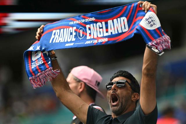 A football fan shows a scarf ahead of the 2026 World Cup football tournament third-place match between France and England at the Miami Stadium in Miami on July 18, 2026.  (Photo by ROBERTO SCHMIDT / AFP)