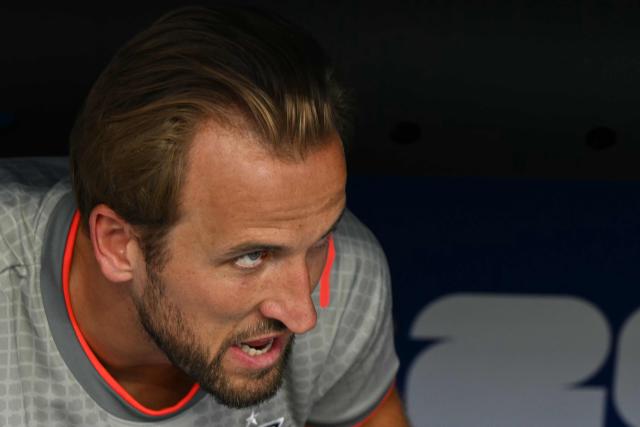 England's forward #09 Harry Kane looks from the bench ahead of the 2026 World Cup football tournament third-place match between France and England at the Miami Stadium in Miami on July 18, 2026.  (Photo by ROBERTO SCHMIDT / AFP)