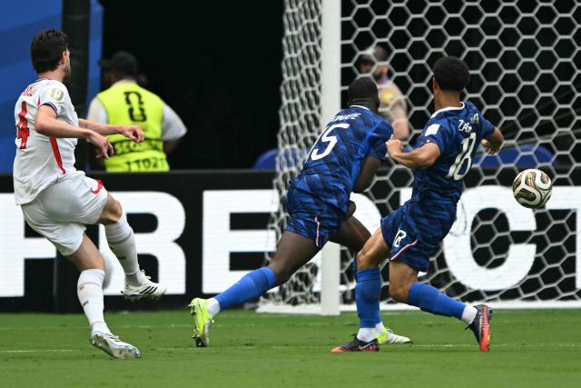 England's midfielder #04 Declan Rice scores his team's first goal during the 2026 World Cup football tournament third-place match between France and England at the Miami Stadium in Miami on July 18, 2026.  (Photo by ROBERTO SCHMIDT / AFP)