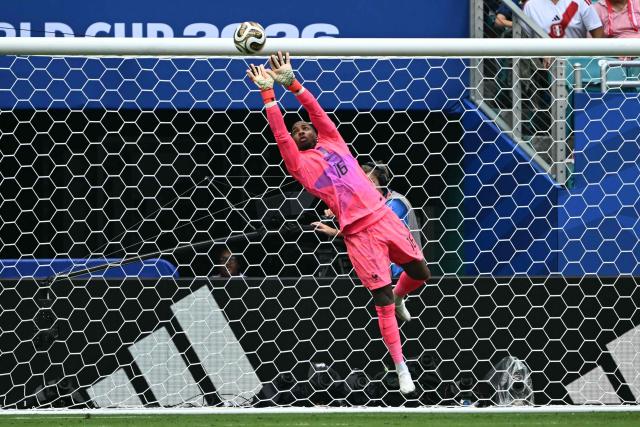 France's goalkeeper #16 Mike Maignan makes a save during the 2026 World Cup football tournament third-place match between France and England at the Miami Stadium in Miami on July 18, 2026.  (Photo by ROBERTO SCHMIDT / AFP)