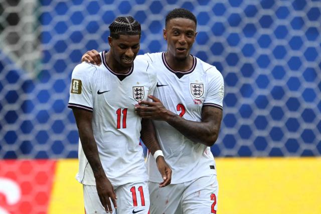 England's forward #11 Marcus Rashford and defender #02 Ezri Konsa celebrate their team's third goal scored by forward #07 Bukayo Saka (unseen) during the 2026 World Cup football tournament third-place match between France and England at the Miami Stadium in Miami on July 18, 2026.  (Photo by ROBERTO SCHMIDT / AFP)