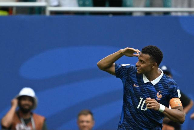 France's forward #10 Kylian Mbappe celebrates scoring his team's first goal during the 2026 World Cup football tournament third-place match between France and England at the Miami Stadium in Miami on July 18, 2026.  (Photo by ROBERTO SCHMIDT / AFP)