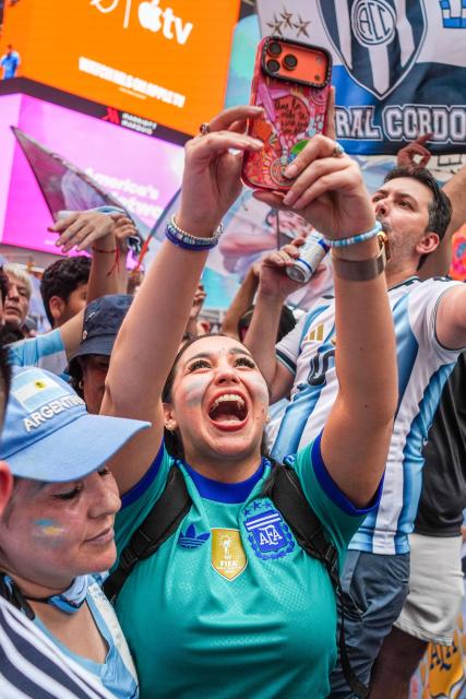 Argentina fans gather and celebrate in Times Square in New York, on July 18, 2026, ahead of the 2026 World Cup Final between Spain and Argentina. (Photo by Ryan MURPHY / AFP)