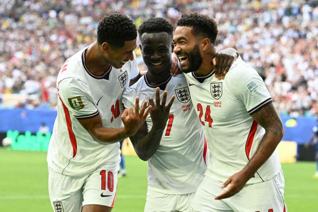 England's forward #07 Bukayo Saka (C) celebrates scoring his team's fifth goal with teammates midfielder #10 Jude Bellingham and defender #24 Reece James during the 2026 World Cup football tournament third-place match between France and England at the Miami Stadium in Miami on July 18, 2026.  (Photo by ROBERTO SCHMIDT / AFP)