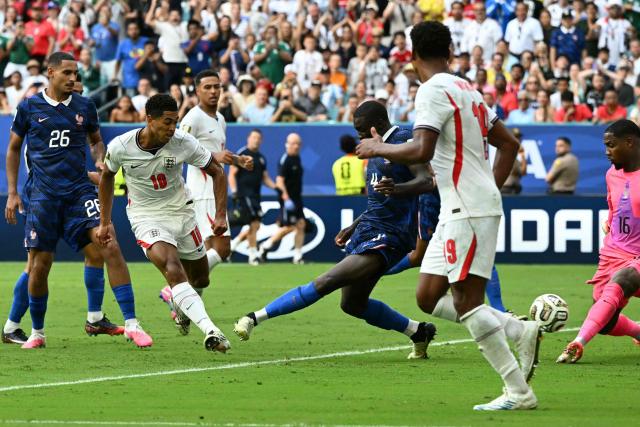 England's midfielder #10 Jude Bellingham scores his team's sixth goal during the 2026 World Cup football tournament third-place match between France and England at the Miami Stadium in Miami on July 18, 2026.  (Photo by ROBERTO SCHMIDT / AFP)
