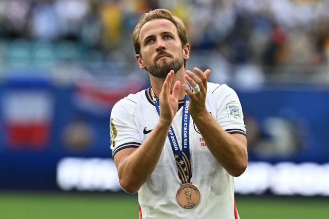 England's forward #09 Harry Kane celebrates with his medal after winning the 2026 World Cup football tournament third-place match between France and England at the Miami Stadium in Miami on July 18, 2026.  (Photo by ROBERTO SCHMIDT / AFP)