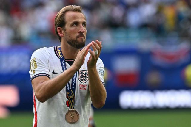 England's forward #09 Harry Kane celebrates with his medal after winning the 2026 World Cup football tournament third-place match between France and England at the Miami Stadium in Miami on July 18, 2026.  (Photo by ROBERTO SCHMIDT / AFP)