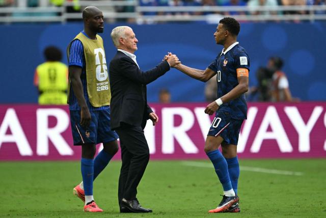 France's head coach Didier Deschamps and France's forward #10 Kylian Mbappe shake hands after losing the 2026 World Cup football tournament third-place match between France and England at the Miami Stadium in Miami on July 18, 2026.  (Photo by ROBERTO SCHMIDT / AFP)