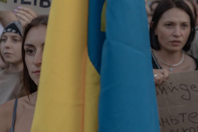 Protesters attend a demonstration against Ukraine's President's decision to dismiss Ukraine's Defence Minister Mykhailo Fedorov, and demanding the dismissal of Ukraine's army chief Oleksandr Syrskyi, in Kyiv on July 18, 2026, amid the Russian invasion of Ukraine. Large protests erupted in several Ukrainian cities against the removal of popular Defence Minister Fedorov, who had been brought in six months ago to digitise and modernise an army fatigued after four years fighting off the Russian invasion. (Photo by Roman PILIPEY / AFP)