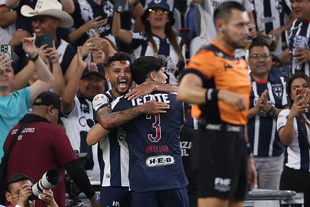 Monterrey's forward #17 Jesus Corona (L) celebrates with Monterrey's defender #03 Gerardo Arteaga after scoring during the Liga MX Apertura football match between Monterrey and Santos Laguna at BBVA stadium in Guadalupe, Nuevo Leon state, Mexico on July 18, 2026. (Photo by Julio Cesar AGUILAR / AFP)
