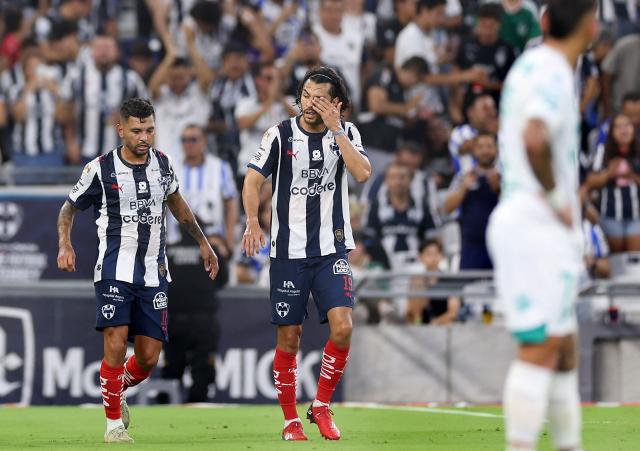 Monterrey's forward #17 Jesus Corona (L) celebrates with Monterrey's defender #19 Alonso Aceves after scoring during the Liga MX Apertura football match between Monterrey and Santos Laguna at BBVA stadium in Guadalupe, Nuevo Leon state, Mexico on July 18, 2026. (Photo by Julio Cesar AGUILAR / AFP)