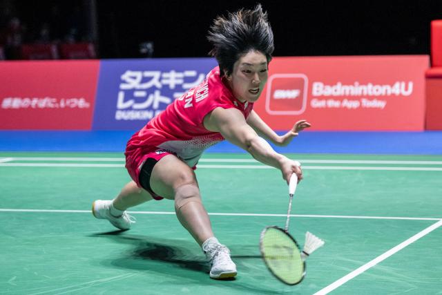 Japan’s Akane Yamaguchi hits a return against India’s Pusarla Venkata Sindhu in their women's singles final match of the Japan Open badminton tournament at Tokyo Gymnasium in Tokyo on July 19, 2026. (Photo by Yuichi YAMAZAKI / AFP)