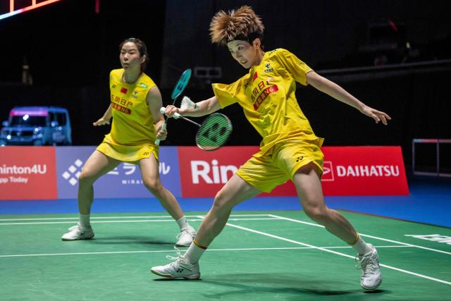 China’s Jia Yifan and Zhang Shuxian play a point against South Korea’s Kim Hye-jeong and Kong Hee-yong during the women's doubles final of the Japan Open badminton tournament at Tokyo Gymnasium in Tokyo on July 19, 2026. (Photo by Yuichi YAMAZAKI / AFP)