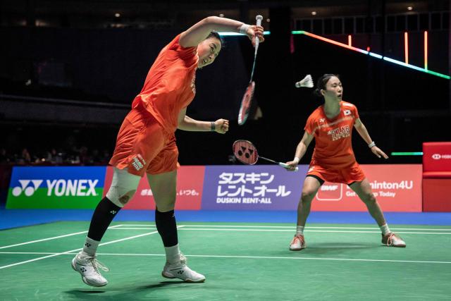 South Korea’s Kim Hye-jeong (L) and Kong Hee-yong play a point against China’s Jia Yifan and Zhang Shuxian during the women's doubles final of the Japan Open badminton tournament at Tokyo Gymnasium in Tokyo on July 19, 2026. (Photo by Yuichi YAMAZAKI / AFP)