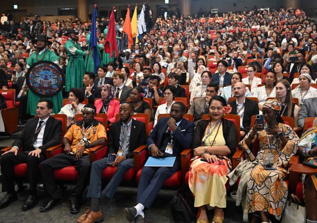 Delegates attend the opening ceremony of the 48th session of the UNESCO World Heritage Committee at BEXCO convention and exhibition centre in Busan on July 19, 2026. (Photo by JUNG YEON-JE / POOL / AFP)