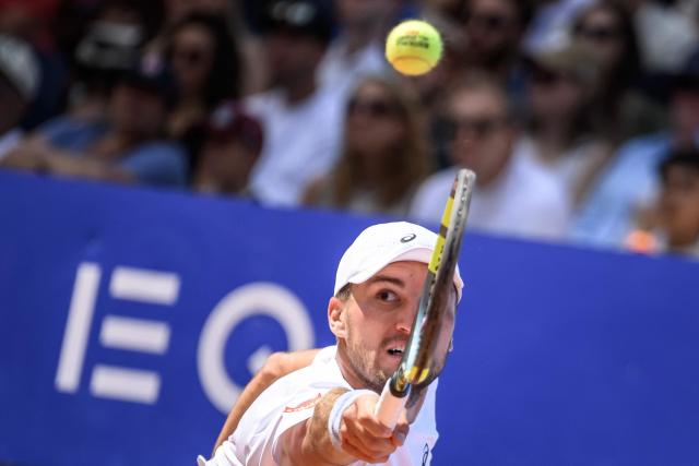 Belgium's Raphael Collignon returns the ball to Greece's Stefanos Tsitsipas during their men's singles final match at the Swiss Open tennis tournament in Gstaad, on July 19, 2026. (Photo by Fabrice COFFRINI / AFP)