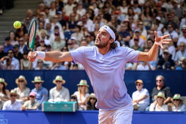 Greece's Stefanos Tsitsipas returns the ball to Belgium's Raphael Collignon during their men's singles final match at the Swiss Open tennis tournament in Gstaad, on July 19, 2026. (Photo by Fabrice COFFRINI / AFP)