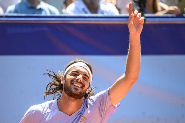 Greece's Stefanos Tsitsipas celebrates his victory against Belgium's Raphael Collignon during their men's singles final match at the Swiss Open tennis tournament in Gstaad, on July 19, 2026. (Photo by Fabrice COFFRINI / AFP)