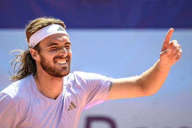 Greece's Stefanos Tsitsipas celebrates his victory against Belgium's Raphael Collignon during their men's singles final match at the Swiss Open tennis tournament in Gstaad, on July 19, 2026. (Photo by Fabrice COFFRINI / AFP)