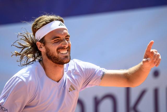 Greece's Stefanos Tsitsipas celebrates his victory against Belgium's Raphael Collignon during their men's singles final match at the Swiss Open tennis tournament in Gstaad, on July 19, 2026. (Photo by Fabrice COFFRINI / AFP)