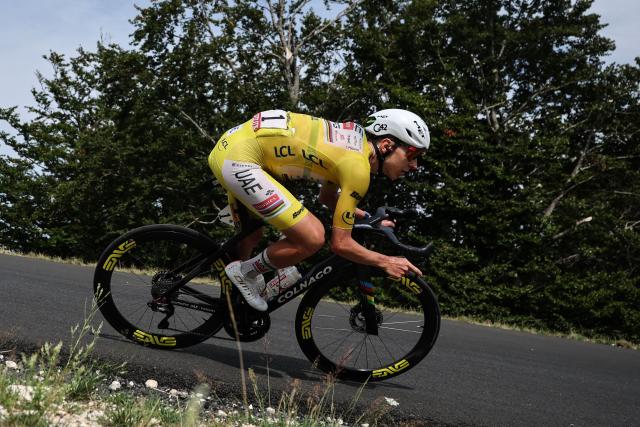 UAE Team Emirates - XRG's Slovenian rider Tadej Pogacar wearing the overall leader's yellow jersey cycles in the descent of the Col de la Croisette during the 15th stage of the 113th edition of the Tour de France cycling race, 183,9 km between Champagnole and Plateau de Solaison in the Jura mountains, on July 19, 2026. (Photo by Anne-Christine POUJOULAT / AFP)