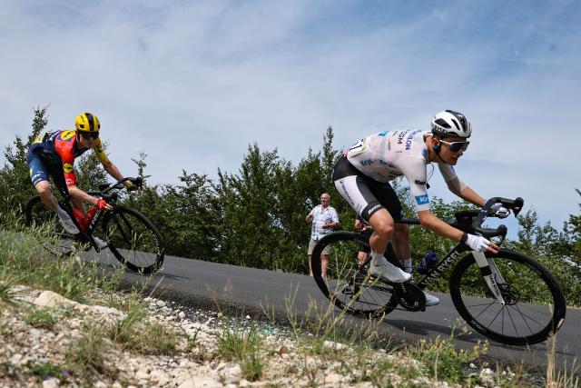 Decathlon CMA CGM Team's French rider Paul Seixas wearing the best young rider's white jersey cycles in the descent of the Col de la Croisette during the 15th stage of the 113th edition of the Tour de France cycling race, 183,9 km between Champagnole and Plateau de Solaison in the Jura mountains, on July 19, 2026. (Photo by Anne-Christine POUJOULAT / AFP)