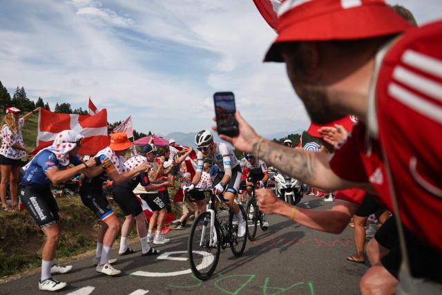 Decathlon CMA CGM Team's French rider Paul Seixas wearing the best young rider's white jersey in the final ascent of the 15th stage of the 113th edition of the Tour de France cycling race, 183,9 km between Champagnole and Plateau de Solaison in the Jura mountains, on July 19, 2026. (Photo by Anne-Christine POUJOULAT / AFP)