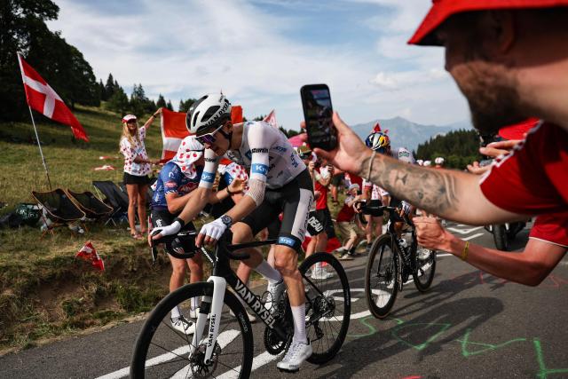 Decathlon CMA CGM Team's French rider Paul Seixas wearing the best young rider's white jersey in the final ascent of the 15th stage of the 113th edition of the Tour de France cycling race, 183,9 km between Champagnole and Plateau de Solaison in the Jura mountains, on July 19, 2026. (Photo by Anne-Christine POUJOULAT / AFP)