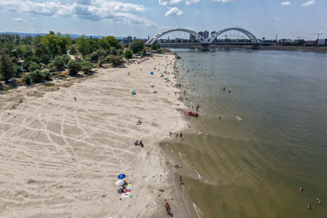 This aerial view shows the low water level of the Danube River near Novi Sad, Serbia, on July 19, 2026. (Photo by Nenad MIHAJLOVIC / AFP)