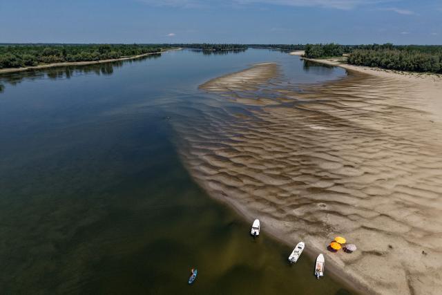 This aerial view shows the low water level of the Danube River near Backa Palanka, Serbia, on July 19, 2026. (Photo by Nenad MIHAJLOVIC / AFP)