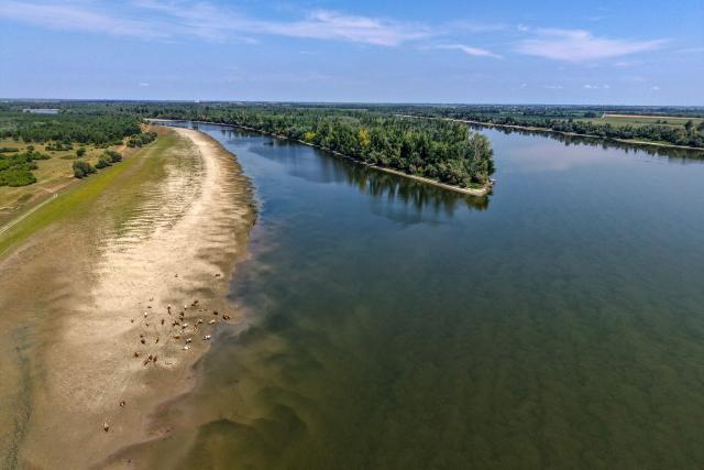 This aerial view shows the low water level of the Danube River near Backa Palanka, Serbia, on July 19, 2026. (Photo by Nenad MIHAJLOVIC / AFP)