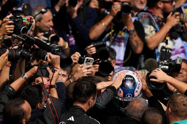 First-placed Mercedes' Italian driver Kimi Antonelli walks among photographers after winning the Formula One Belgian Grand Prix at the Spa-Francorchamps circuit, in Spa, on July 19, 2026. (Photo by JOHN THYS / AFP)
