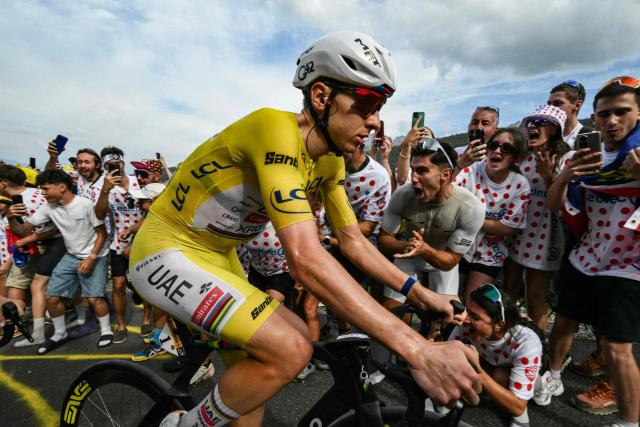 UAE Team Emirates - XRG's Slovenian rider Tadej Pogacar wearing the overall leader's yellow jersey cycles in the final ascent of the 15th stage of the 113th edition of the Tour de France cycling race, 183,9 km between Champagnole and Plateau de Solaison in the Jura mountains, on July 19, 2026. (Photo by Jeff PACHOUD / AFP)