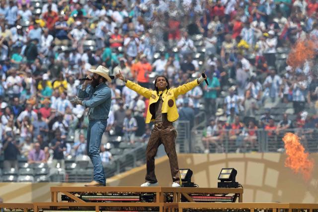 US singers Post Malone (L) and Swae Lee perform ahead of for the 2026 World Cup football tournament final match between Spain and Argentina at the New York/New Jersey Stadium in East Rutherford on July 19, 2026.  (Photo by JUAN MABROMATA / AFP)