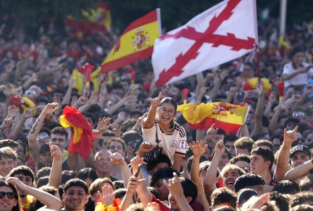 Spain's supporters cheer prior the 2026 World Cup final match between Spain and Argentina in front of giant screens at Colon square's fan zone in Madrid, on July 19, 2026. (Photo by Paul Hanna / AFP)